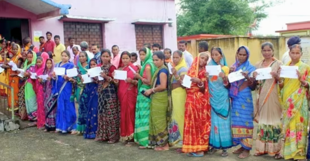 A picture of voters waiting in line outside a polling station in Sepahijala district, Tripura