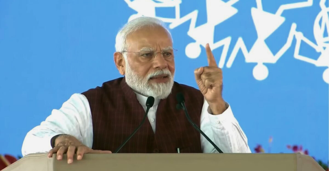 Prime Minister Narendra Modi addressing a large crowd in Bina, Madhya Pradesh, discussing the controversy surrounding Sanatana Dharma and the alleged hidden agenda of the INDIA Alliance to undermine Indian culture